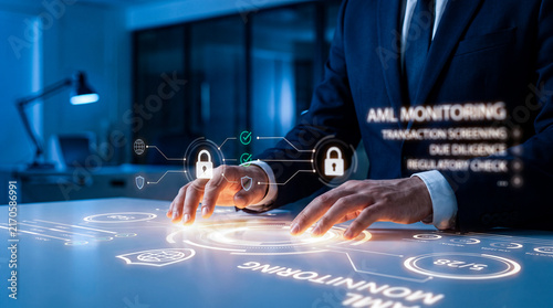 Corporate expert managing digital aml monitoring system with transaction screening interface for regulatory risk compliance.
