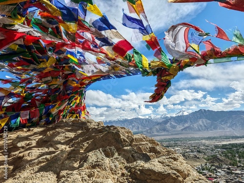 Фотография Buddhist prayer flags over the city of Leh,India