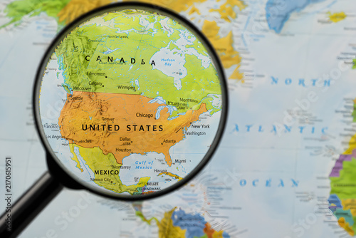 Magnifying glass focusing on Japan map for East Asia travel and trip planning concept