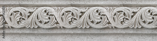 Fotografie Ornate stone carving displaying classical floral architectural frieze