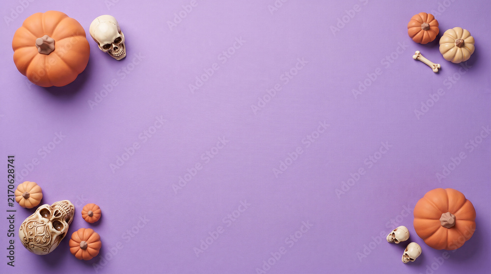 Fototapeta premium Pumpkins and human skulls are arranged on a lilac colored background creating a halloween themed composition autumnal bone calavera celebration cranium decay