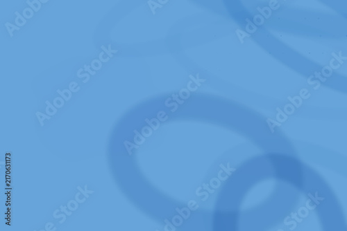 Abstract background, featuring overlapping light, blue circular rings, on a solid, blue surface, creating, a subtle and, clean geometric pattern