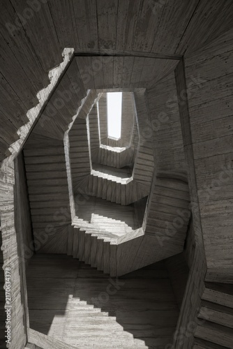 Brutalist concrete stairwell spiral seen from below
