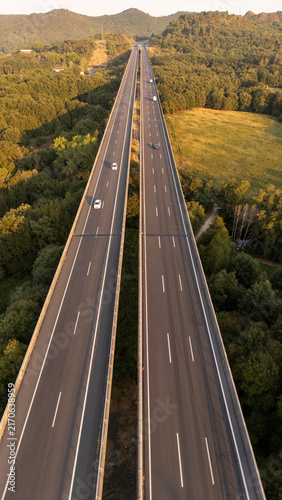 Highway viaduct spanning natural landscape in Galicia