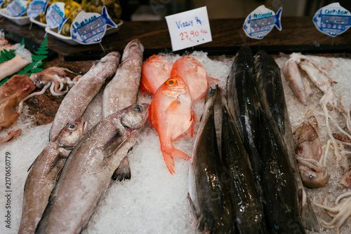 Fresh seafood displayed on ice at fish market