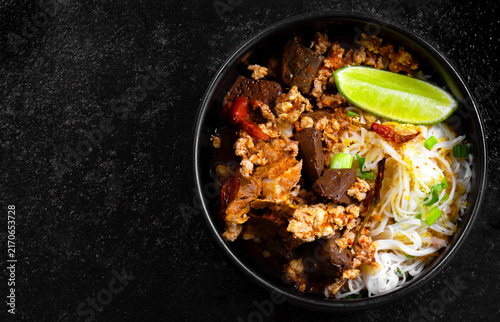 Rice Vermicelli with Northern Thai Curry Sauce (Khanom Chin Nam Ngiao) is a local dish from Northern Thailand.