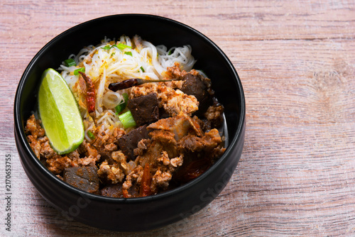 Rice Vermicelli with Northern Thai Curry Sauce (Khanom Chin Nam Ngiao) is a local dish from Northern Thailand.
