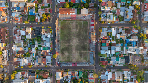 Aerial view of Club Deportivo Guarani Antonio Franco stadium surrounded by dense urban residential blocks and streets in Posadas, Misiones, Argentina.