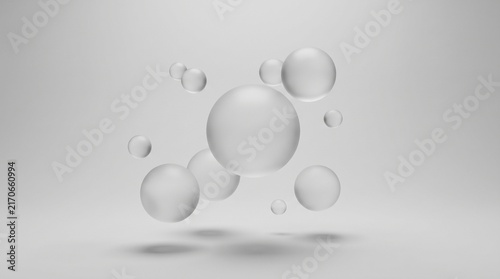 Floating white spheres and 3D balls on gray background. Abstract geometric shapes with soft shadows in a minimalist studio setting