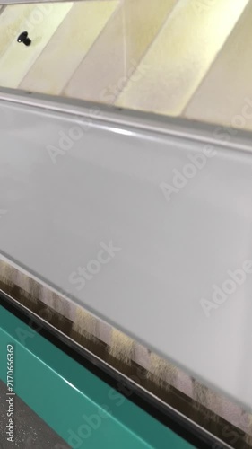 Vertical video. Modern automated equipment for sifting flour and separating bran in a food processing plant, showcasing the machinery shaking and grading the product through different sieves