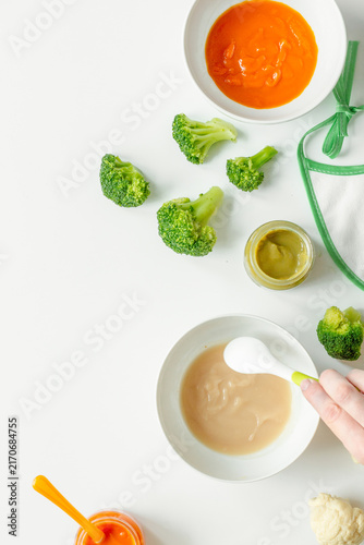 cooking vegetable puree for baby on white background top view