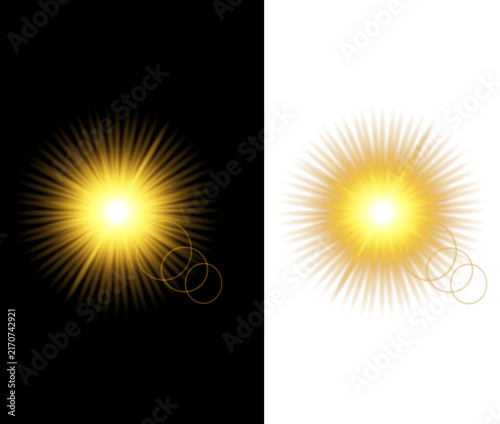 Golden sunburst light effect with lens flare on black and white backgrounds