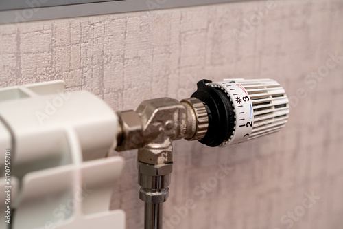 Fotografie Close Up of White Radiator Thermostatic Valve on a Central Heating System in a M