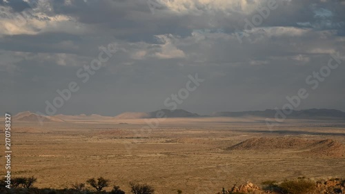 Clouds drift over the Namibian desert, African landscape. Timelapse.