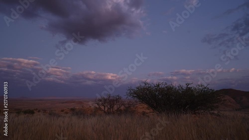 Clouds drift over the Namibian desert, African landscape. Timelapse.