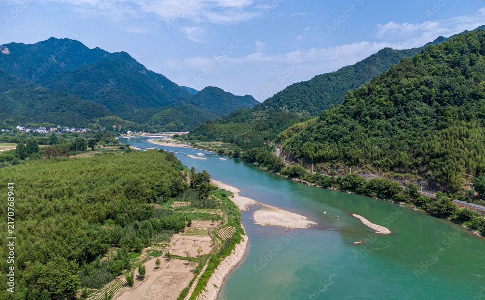 Fototapeta premium Scenic River Valley with Lush Greenery