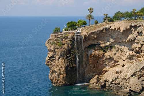 Coastal waterfall at Ziya Gokalp Kent Park on Bababurnu Cape in Fener, Muratpasa, Antalya, Turkey overlooking the Mediterranean Sea.
