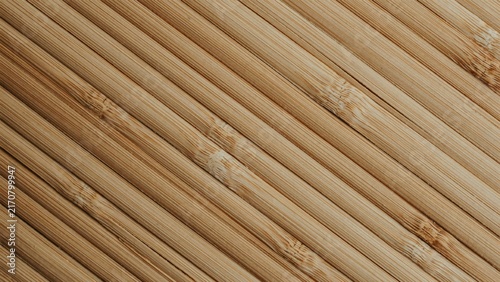 Natural bamboo sticks texture background, diagonal wooden reed pattern for spa and wellness design, organic tan wood slat surface, eco-friendly material backdrop.