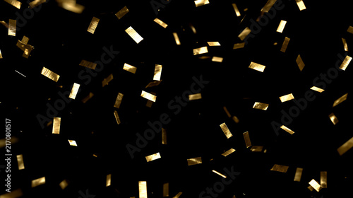 Falling gold confetti on black background. Shiny metallic foil decoration for party or celebration. Luxury festive holiday backdrop.  New Year's Eve designs. Christmas decoration