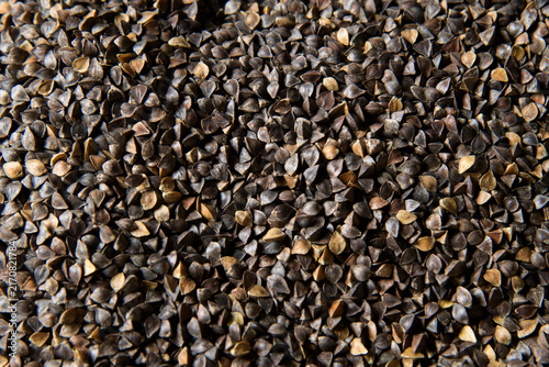 Konstfotografi Overhead view of dried buckwheat groats displaying natural brown and tan tones w