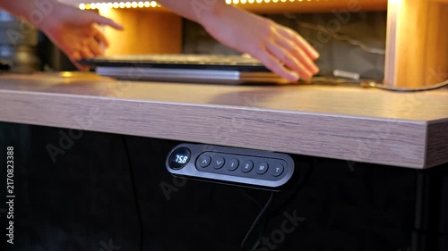 Person setting up laptop and workspace to start working from home