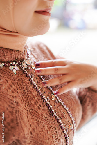 Close up detail of Woman in Javanese Traditional Embellished Kebaya