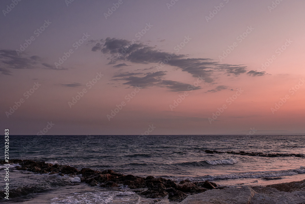 Obraz premium View of Pervolia village sea coast, beach and sea, after sunset, Larnaca district, Cyprus