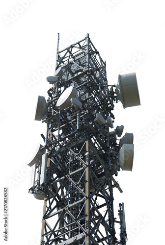 A tall metal telecommunications tower covered in various antennas and dishes.