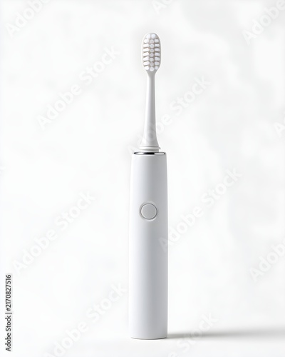 Minimal white electric toothbrush handle without branding, upright position isolated on white background