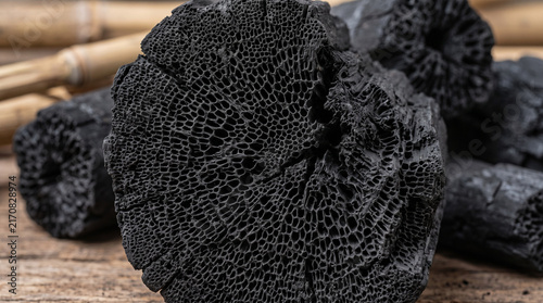 Bamboo charcoal texture close-up. Natural black carbon fuel for purification and skincare.