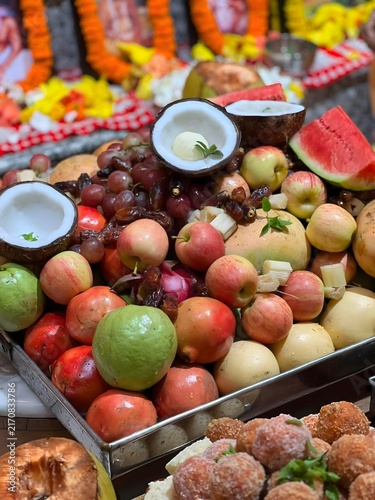 Фотография Abundant fresh fruits and sweets arranged for a religious offering with soft bok