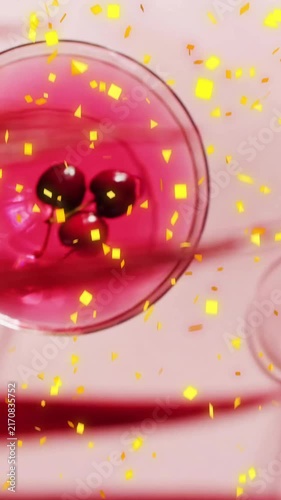 Animation of confetti falling and cocktail on pink background