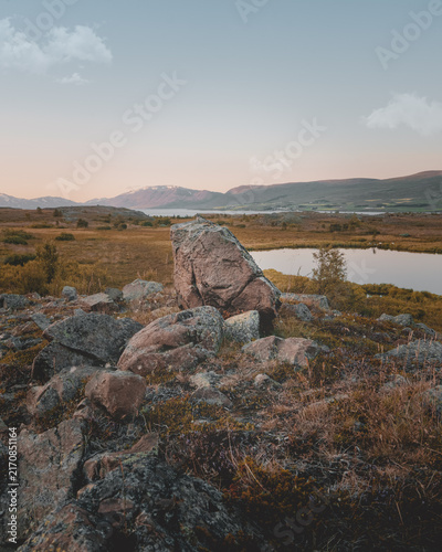 Фотография Rocky Icelandic landscape with lake and mountains at dusk