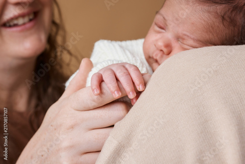 Mother Holding Sleeping Newborn Baby Close Up - Multiracial Family Bonding and Tender Care
