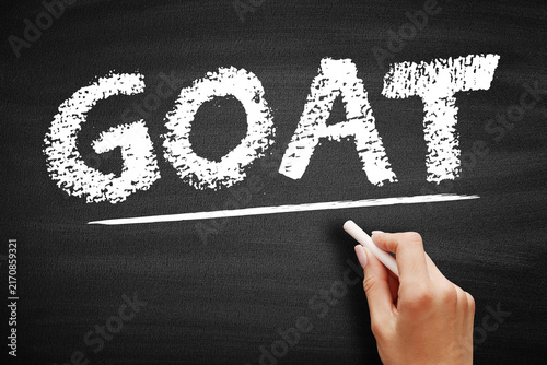 GOAT stands for Greatest of All Time, a term used to describe an individual who is considered the best in their field, displayed in chalk on a classic school chalkboard