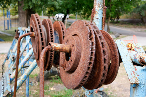 Brutal homemade training machinery weights made of rusty car brake discs
