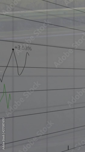 Rising financial graph with data points animation over blurred office background