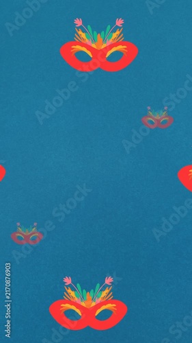 Animation of carnival mask repeated on blue backgroud