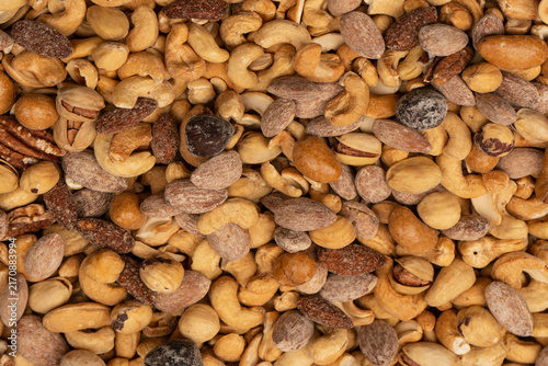 A group of almonds, pistachios, walnuts, macadamia, cashews.