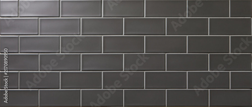 Contemporary Seamless Background of Dark Grey Subway Tiles with Contrasting Light Grout, Ideal for Modern Interior Design Concepts, Kitchen Backsplashes, Bathroom Walls, Creating a Clean