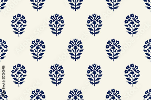 Photography Indian block print seamless pattern with small ikat floral motifs arranged in neat grid on warm cream background traditional hand carved woodblock textile design