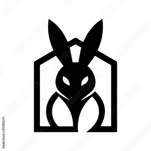 Minimalist black and white rabbit icon inside a house shape outline.