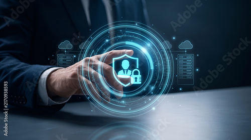 Businessman touching virtual screen with cybersecurity and data protection shield icon representing cloud network security and identity management