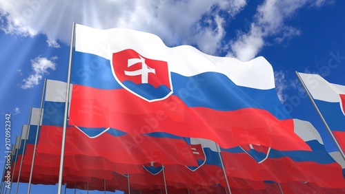Multiple Slovakia flags waving on blue sky