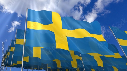 Multiple Sweden flags waving on blue sky