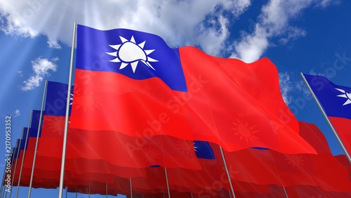 Multiple Taiwan flags waving on blue sky