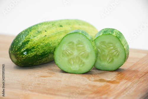 Organic Slice of Cucumber Isolated on White Background