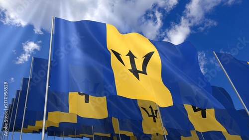 Multiple Barbados flags waving on blue sky