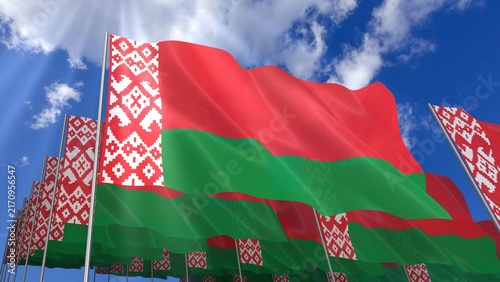 Multiple Belarus flags waving on blue sky
