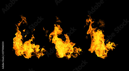 Fotografie Three vivid orange fire flames isolated on a black background, creating a dramatic abstract flame effect for energy, heat, power, action, gaming, advertising, cinematic visuals, and creative design